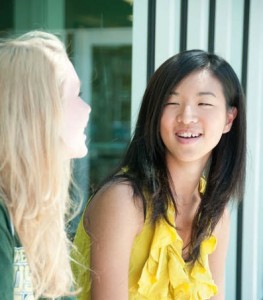 Blonde and dark haired student together - cropped