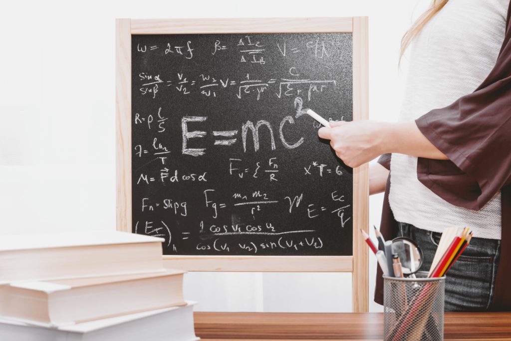 blackboard with mathematical equations written on it