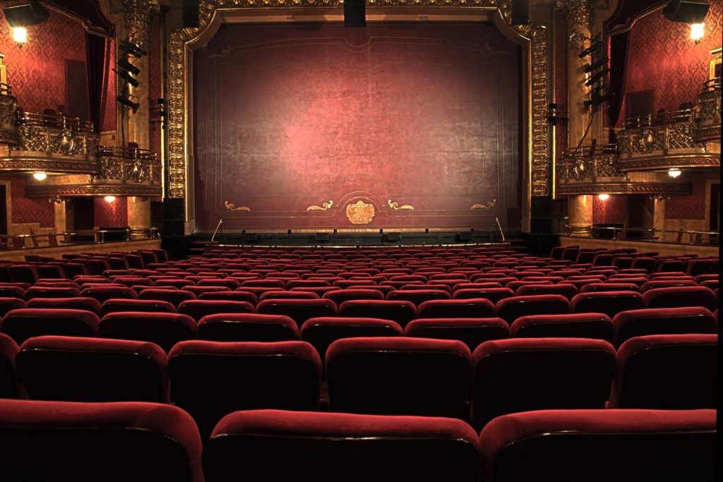 theatre stage with red seats