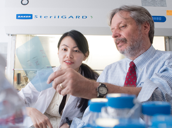 student and professor in lab