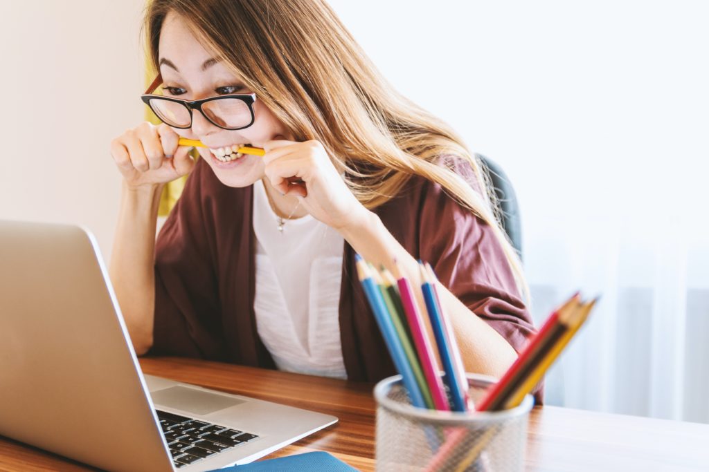 Student biting her pencil in frustration